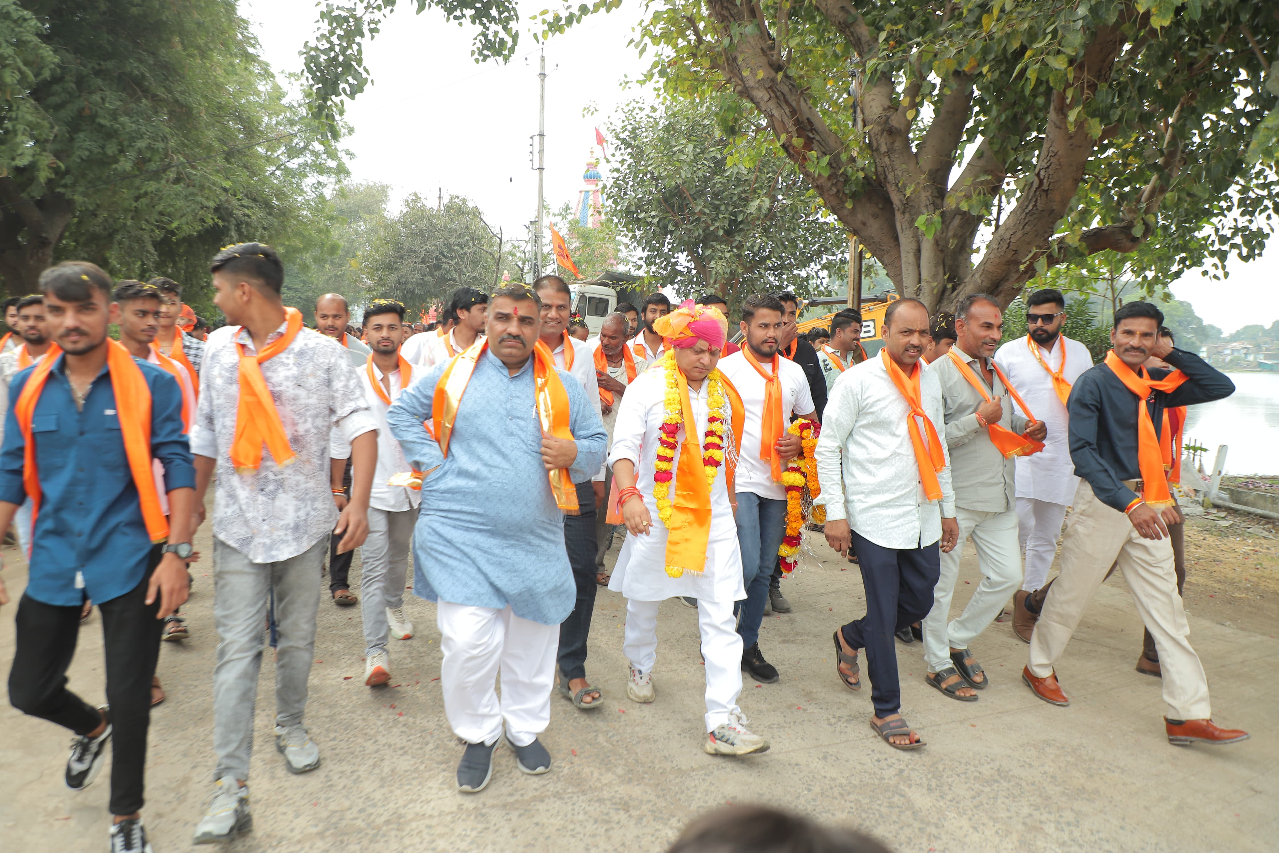 People gathered to welcome Dhar's son, workers came out holding the saffron flag...a grand welcome was given